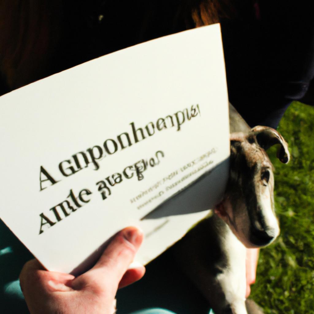 Person holding greyhound adoption pamphlet